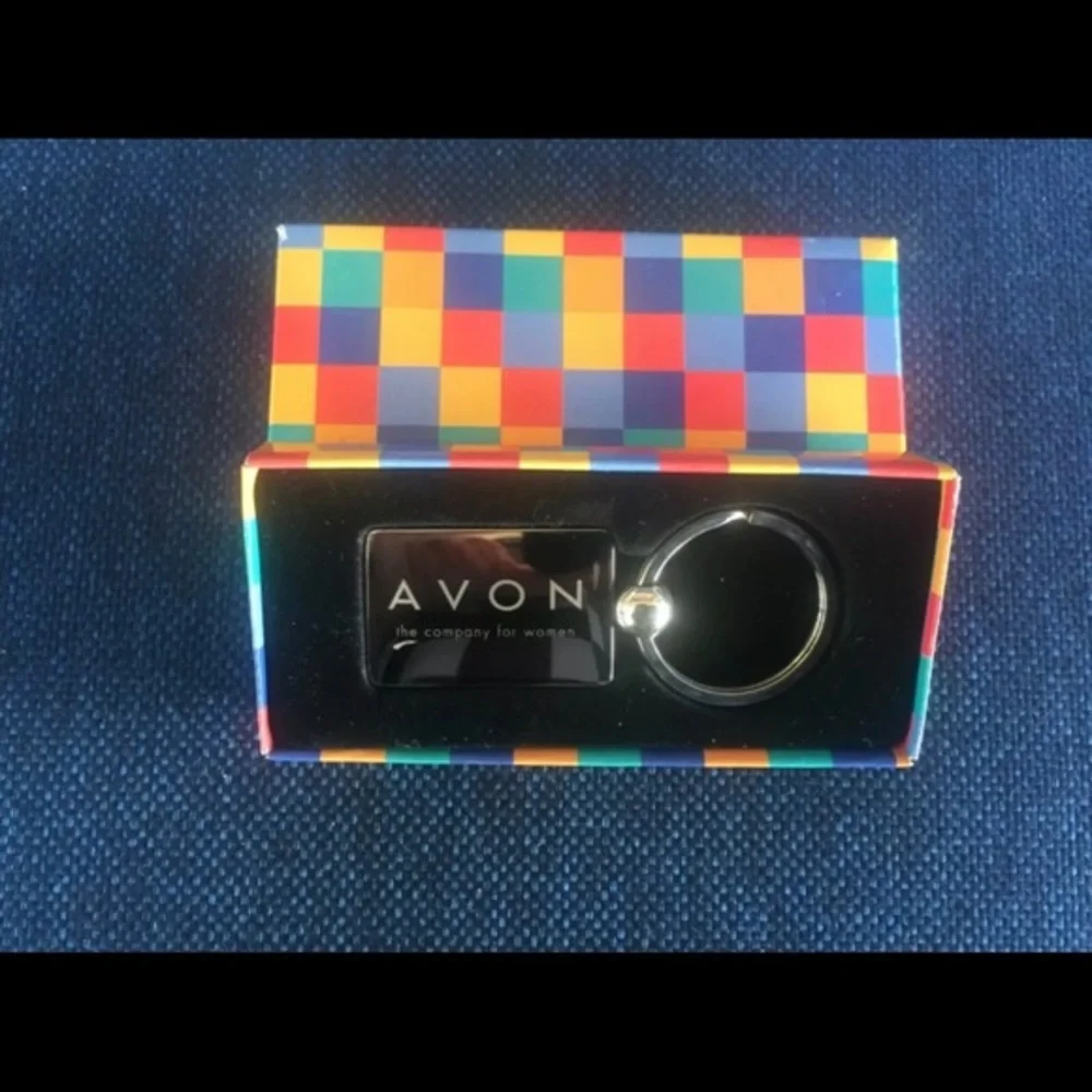 New in Gift Box Silvertone Avon Logo Key Ring